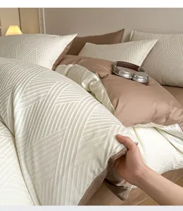Cotton jacquard four-piece bedding set with geometric pattern, beige and brown dual tone.