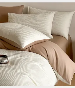 Cotton jacquard four-piece bedding set, geometric pattern duvet cover and pillowcases.