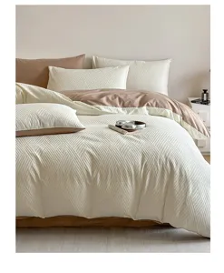 Cotton jacquard bedding set detail view, soft geometric duvet cover and matching pillowcases.