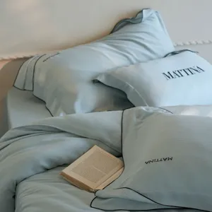 Detail view of smooth Tencel bedding pillowcase with elegant black trim and cooling feel.
