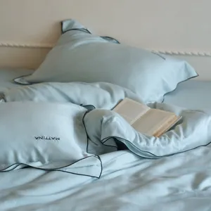 Luxury tencel bedding detail, soft silky lyocell duvet cover and pillowcase set with piping.