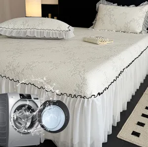 Detail shot of the cooling ice silk bed skirt set with delicate ruffles and jacquard design.