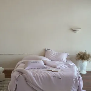 Luxurious solid color Tencel lyocell 4-piece bedding set, silky, cool, and soft luxury decor.