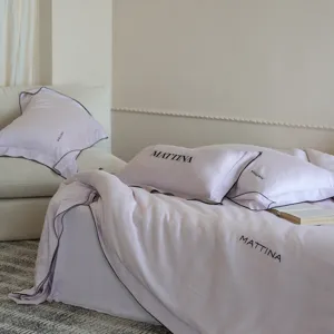 Luxurious pastel purple tencel bedding detail, smooth lyocell fabric pillowcase setup.