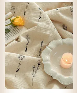 Floral embroidered cotton linen summer quilt detail showcasing soft fabric and cozy style.