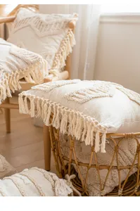 Boho decorative throw pillow cover with tufted geometric pattern and fringe details.