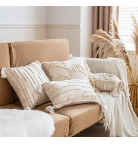 Boho throw pillow covers with tassels, neutral cream decorative couch cushion cases.