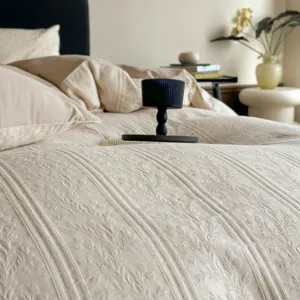 Detailed view of luxury jacquard cotton duvet cover featuring elegant vertical stripes and retro style.