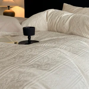Detail view of luxury cotton jacquard bedding set with elegant vintage floral pattern.