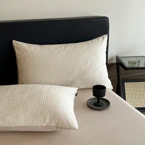 Detailed view of luxury jacquard pillowcase with elegant vintage floral pattern texture.
