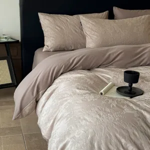 Luxury jacquard bedding detail, premium taupe cotton duvet cover texture and cozy bedroom scene.