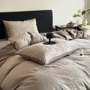 Luxurious cotton jacquard bedding detail, elegant floral pattern duvet cover and pillowcase.