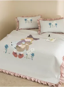 Summer cooling quilt detail view, cute cartoon pattern, pink ruffles, soft washed cotton fabric.
