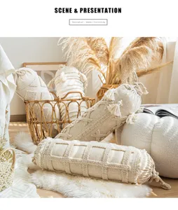 Detail view of bohemian cylinder candy pillow, plush tassel and textured bolster.