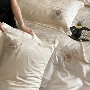 French luxury jacquard sateen bedding four piece set with elegant embroidery and pillowcases.