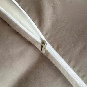 Detailed close-up view showing premium pure cotton bedding duvet cover zipper and fabric texture.