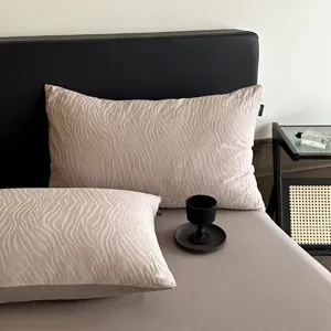 Luxury jacquard cotton pillowcase detail showcasing elegant wavy pattern and retro design.