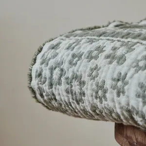 Vintage old money style cotton jacquard throw blanket with fringe for sofa and office.