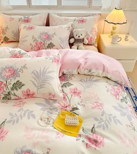 Soft pink floral bedding detail, cozy cotton duvet cover close-up with aesthetic bedroom decor.