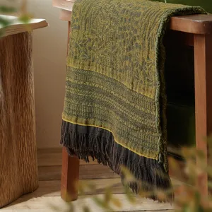 Vintage cotton jacquard throw blanket with fringe detail, cozy sofa cover for living room decor.