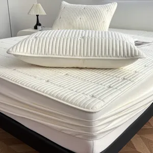 Quilted waterproof fitted bed sheet mattress protector with pillowcases, elegant embroidery design.