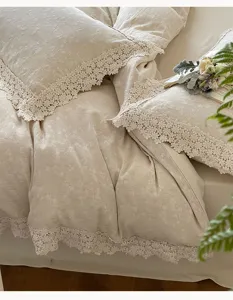 French jacquard cotton linen bedding set detail view with elegant hollow lace trim design.