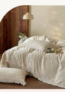 French jacquard cotton linen bedding detail showing exquisite hollow-out lace border craftsmanship.