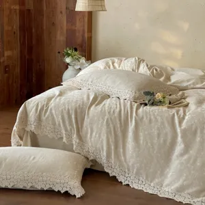 French jacquard cotton linen bedding set with delicate hollow lace edging for cozy bedroom.