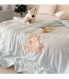 Detailed view of the washed cotton cute cartoon embroidered summer quilt featuring a charming cat.