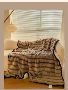 Luxurious faux rabbit fur plush blanket with pom pom trim, cozy wavy throw for single bed.
