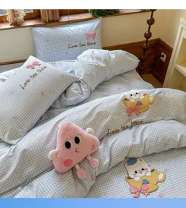 Blue and white checkered cotton bed sheet set with cute cartoon cat embroidery and plush toys.