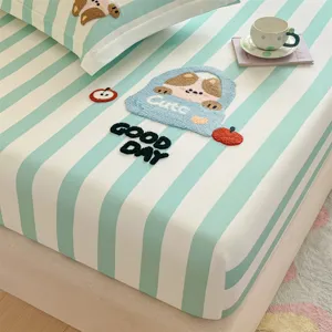 Mint green striped cotton fitted sheet set with cute embroidered animal patch and pillows.