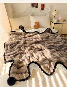 Luxury rabbit plush blanket with wavy lace and pom pom trim for cozy single bed bedroom decor.