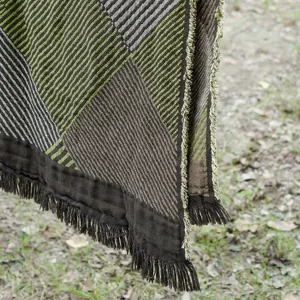 Vintage jacquard cotton blanket throw with fringe detail for sofa office nap use close up
