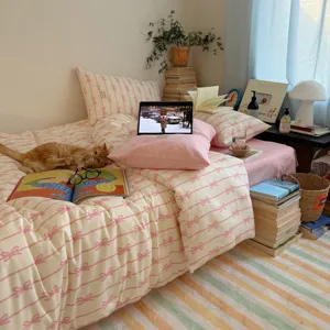 Parure de lit 4 pieces en coton imprime nœud style ins coreen pour chambre chaleureuse.