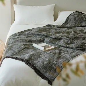 Vintage cotton jacquard throw blanket with elegant fringe, perfect for bed or sofa use.