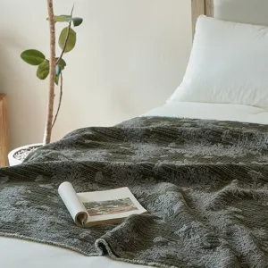 Vintage style cotton jacquard throw blanket for sofa and bed, elegant bedroom decor detail.