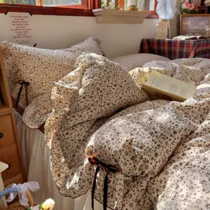 Vintage floral ruffle bedding set with cute brown bow ties, soft fabric, cozy bedroom aesthetic.
