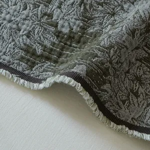 Vintage cotton jacquard throw blanket with floral fringe sofa blanket detail view.