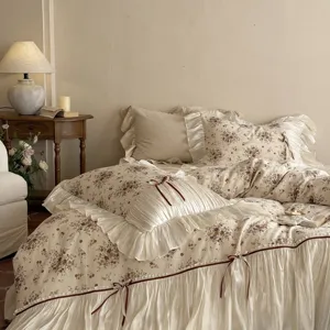French vintage cotton linen floral print bedding set with romantic bows and ruffles.