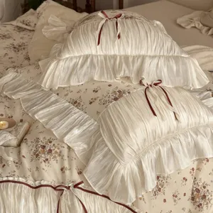 French vintage floral bedding set with romantic ruffles and elegant burgundy ribbon bows.