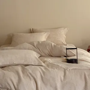 Detailed view of luxury jacquard cotton linen bedding showcasing fine Wabi-sabi texture.