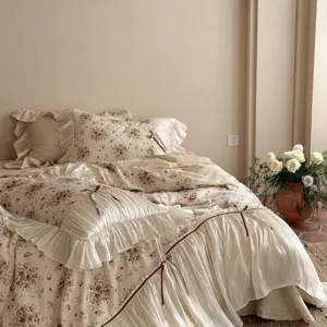French vintage floral bedding detail shot, shabby chic ruffles and sweet bow tie decor.