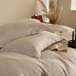Close-up detail of luxury cotton linen jacquard bedding pillowcase wabi-sabi style aesthetic.