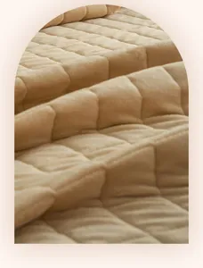 Thickened milk velvet quilted bed cover detail, soft plush fabric texture for warm winter bedding.
