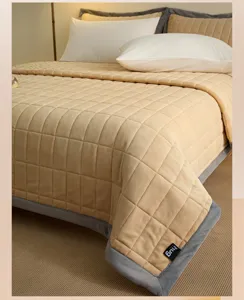 Thickened milk fleece quilted bed cover, soft and warm winter blanket for cozy bedroom decor.
