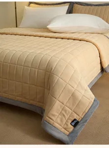 Thickened milk velvet quilted bed cover detail, soft warm fabric with grey edge trim.