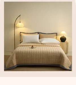Detailed view of the thickened milk velvet quilted bed cover with elegant grey border.