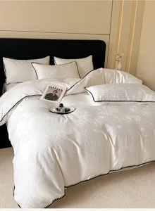 Parure de lit 4 pièces en pur coton de luxe avec élégante bordure noire et jacquard.