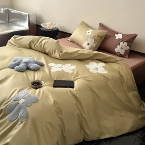 Long-staple cotton duvet cover set with chic towel embroidery floral design, cozy bedding.